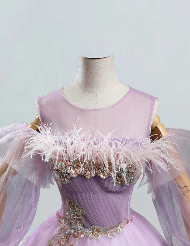 a mannequin dressed in a pink dress with feathers a mannequin dressed in a pink dress with feathers