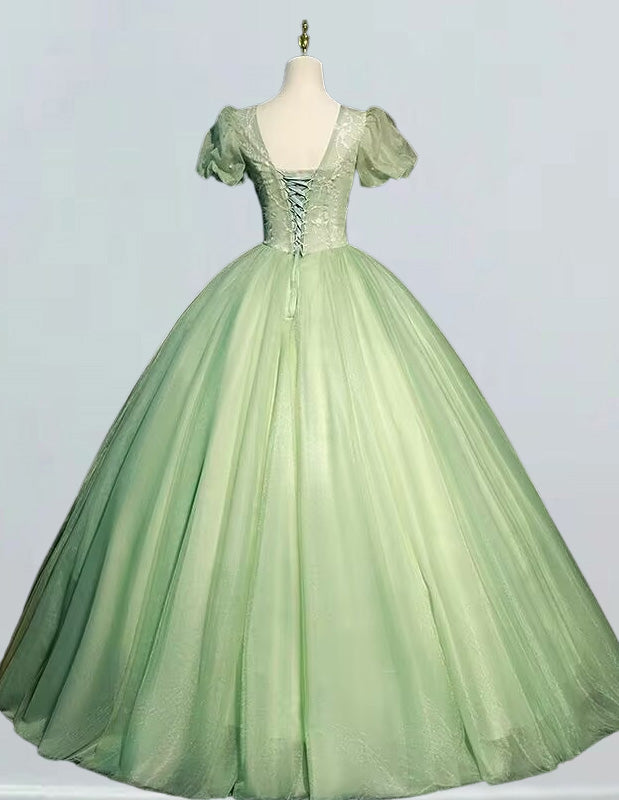 a green ball gown on a mannequin a green ball gown on a mannequin