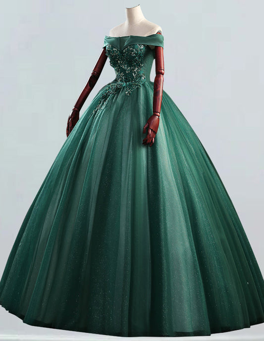 a green ball gown with red gloves on a mannequin