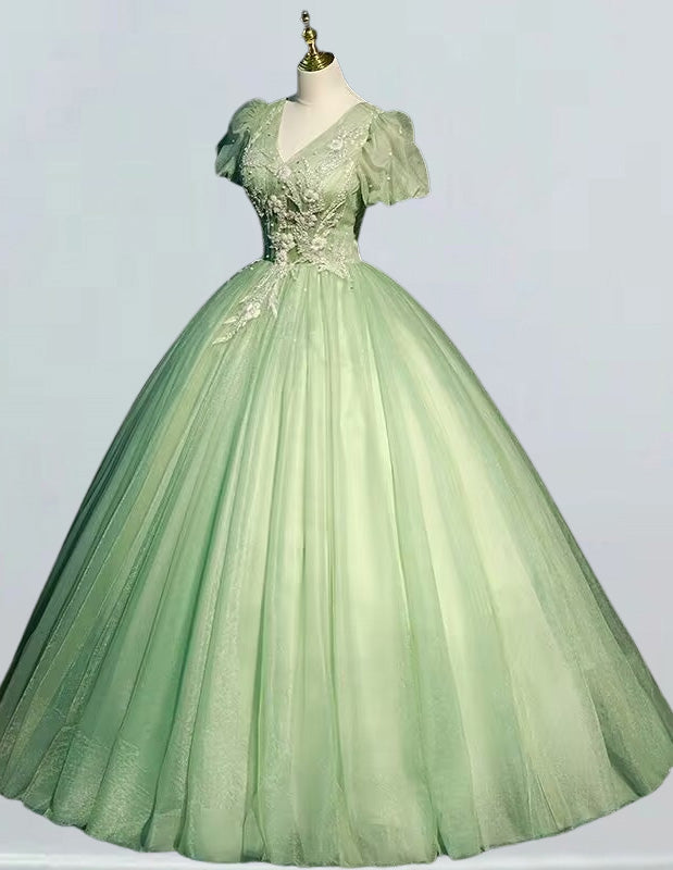 a green ball gown on a mannequin