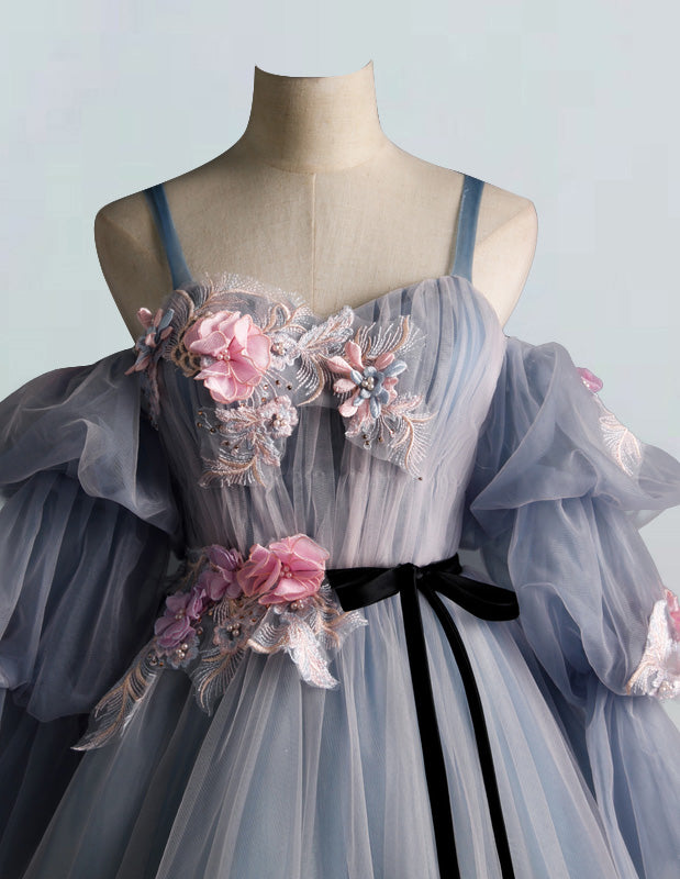 a dress on a mannequin with flowers on it