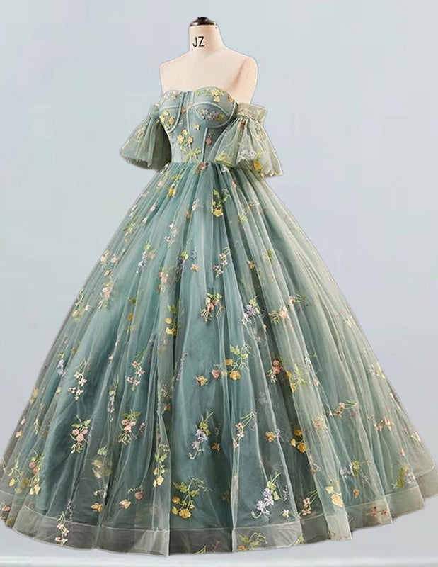 a dress on a mannequin with flowers on it