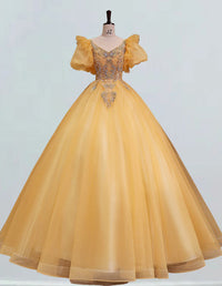 a yellow ball gown on a mannequin