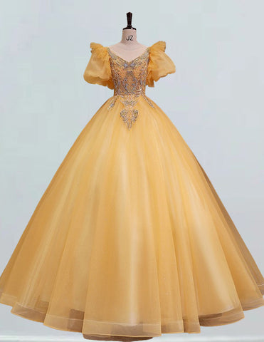 a yellow ball gown on a mannequin