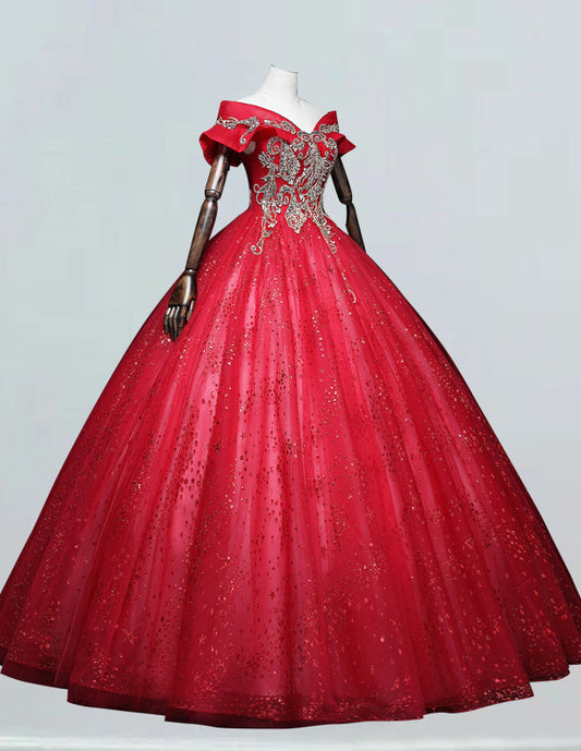 a red ball gown with sequins and bows