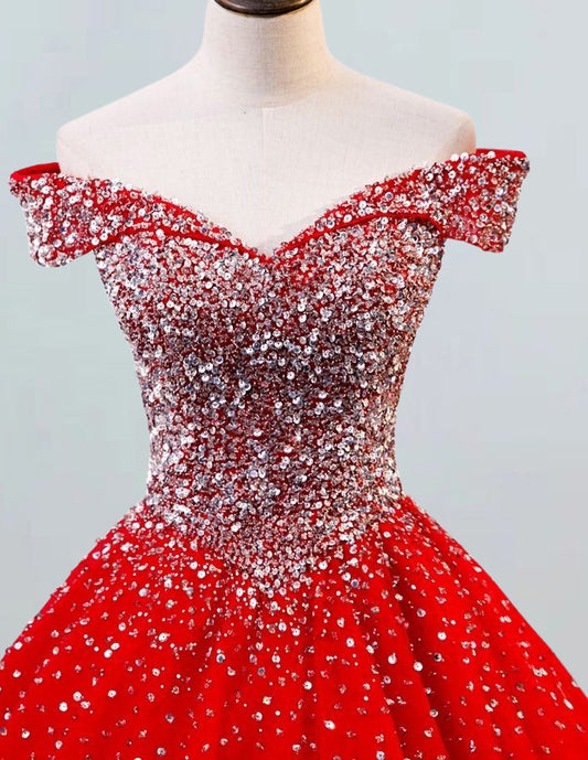a red and silver dress on a mannequin