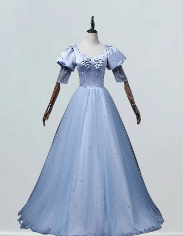 a dress on a mannequin on a white surface