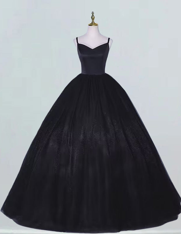 a black ball gown on a mannequin