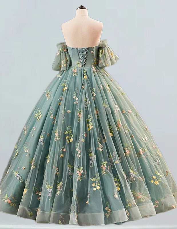 a dress on a mannequin with flowers on it