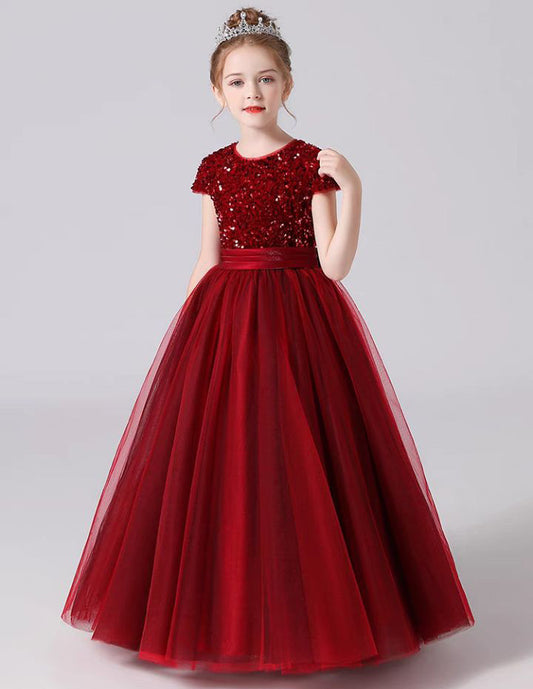 a little girl wearing a red dress VIMYES