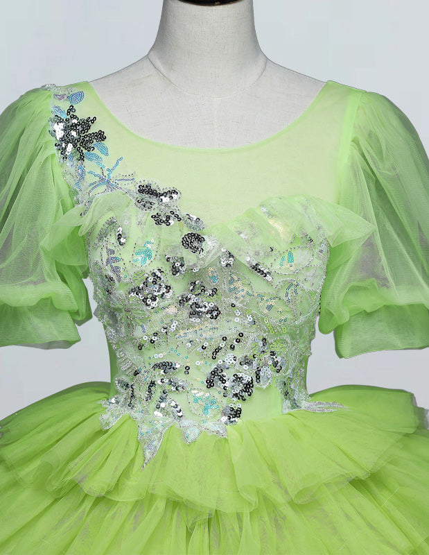 a mannequin wearing a green dress with sequins