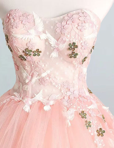 a dress on a mannequin with flowers on it