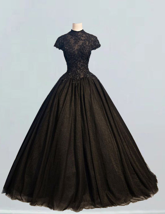 a black dress on a mannequin stand