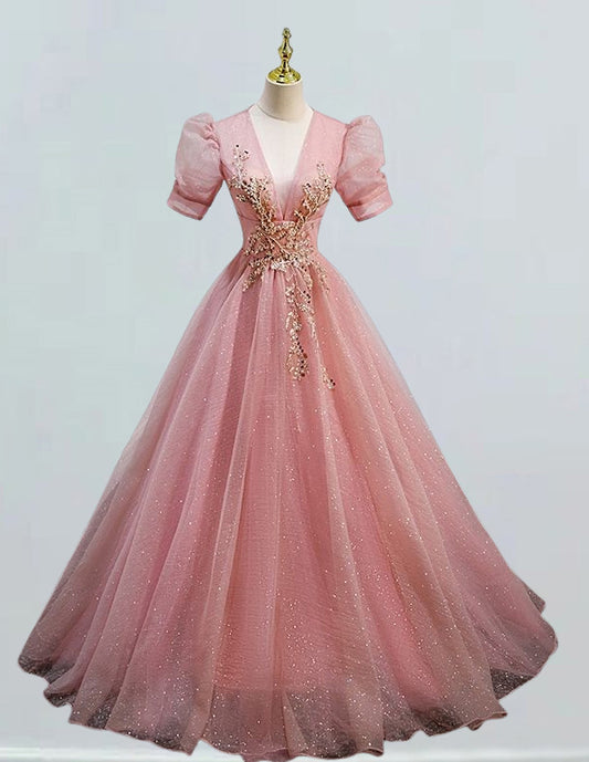a pink ball gown on a mannequin