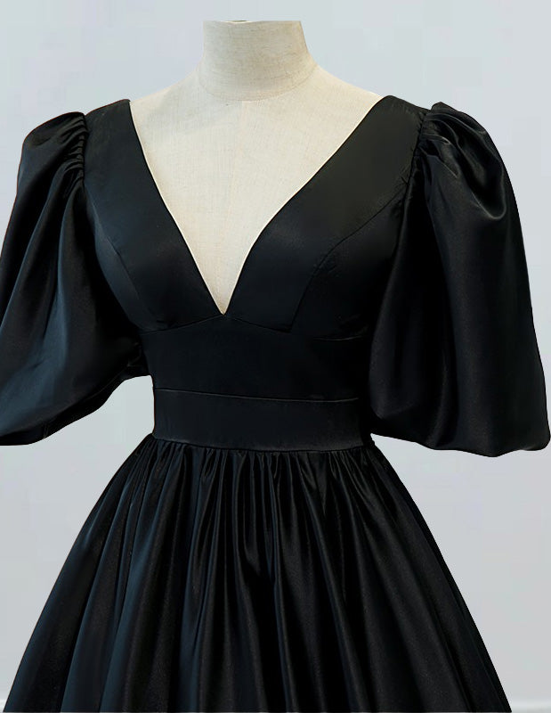 a black dress on a mannequin head
