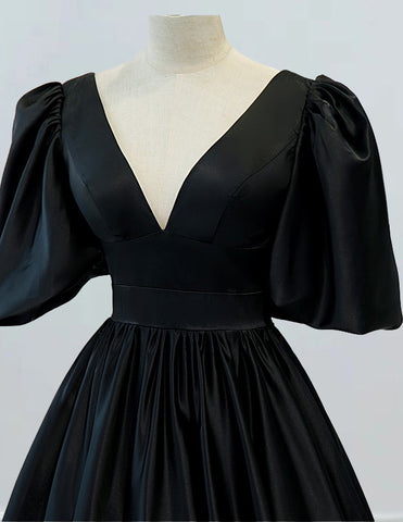 a black dress on a mannequin head