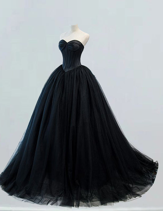 a black ball gown on a mannequin