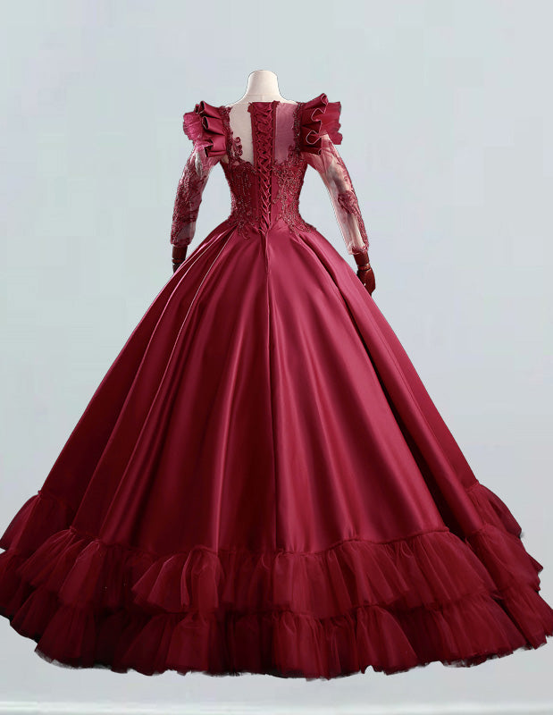 a red ball gown with long sleeves and ruffled skirt