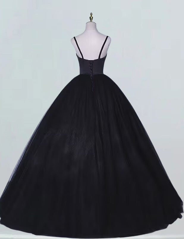 a black ball gown on a mannequin