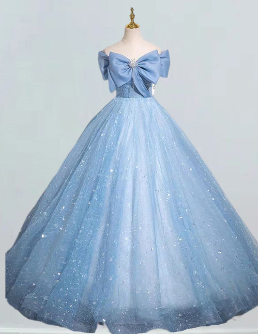 a blue ball gown with a bow on the shoulder