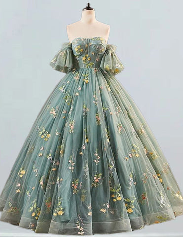 a dress on a mannequin with flowers on it