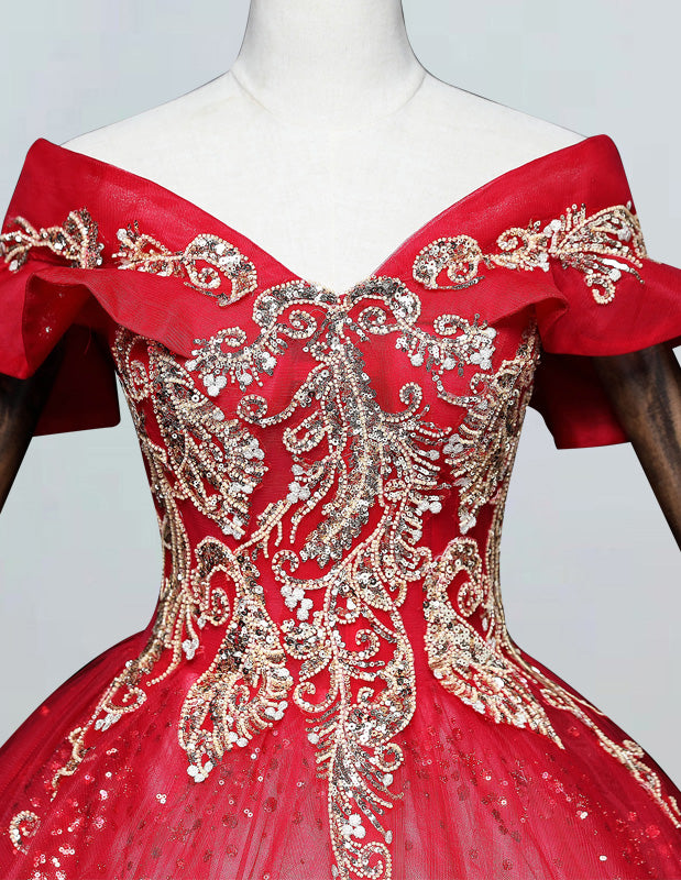 a red ball gown with gold and silver sequins
