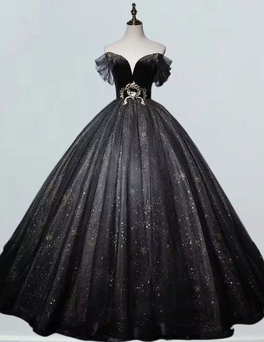 a black and gold ball gown on a mannequin