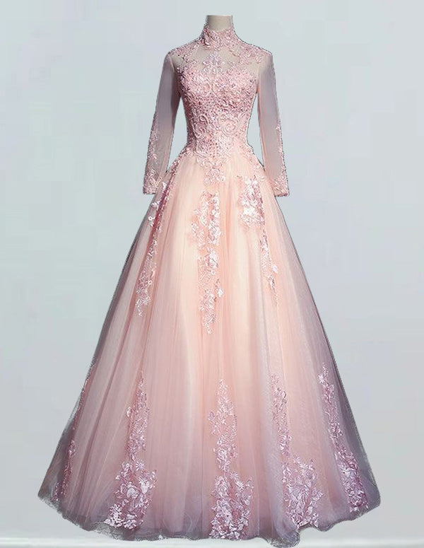 a pink ball gown with long sleeves and flowers on the skirt