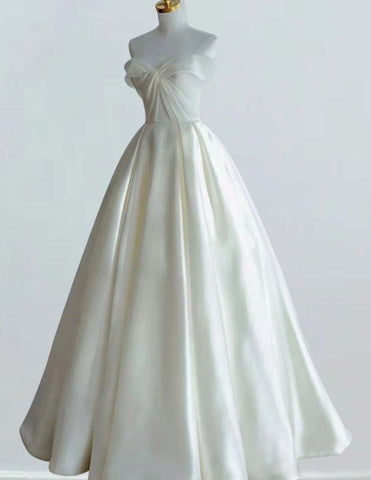 a white wedding dress on a mannequin