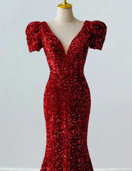 a red sequin dress on a mannequin
