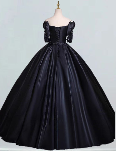 a black ball gown on a mannequin