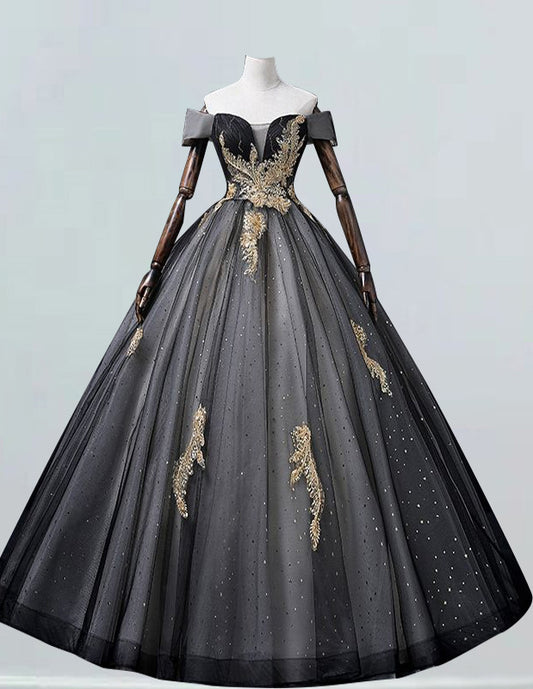 a black and gold ball gown on a mannequin