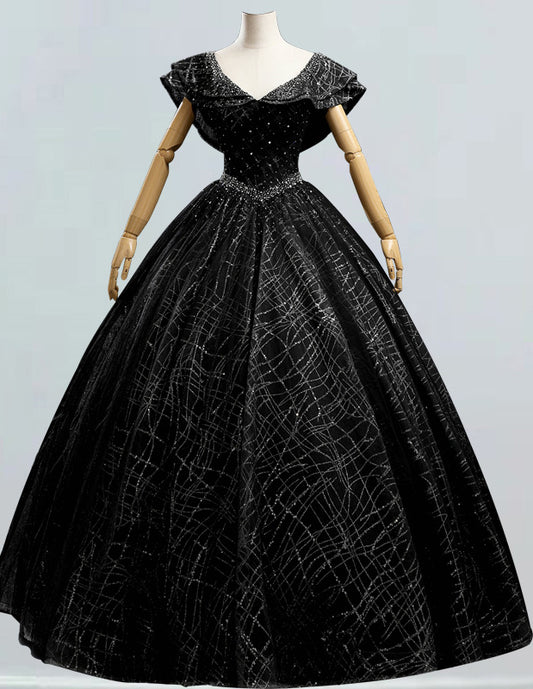 a mannequin wearing a black ball gown