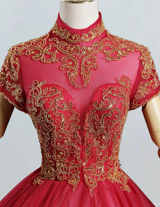 a red and gold dress on a mannequin