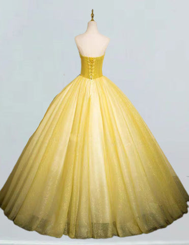a yellow ball gown on a mannequin