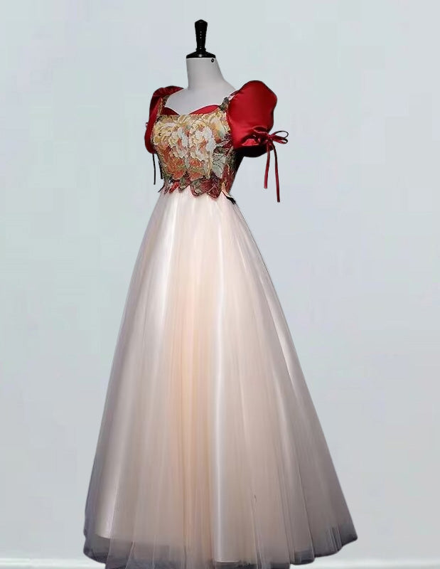 a dress on a mannequin with a red bow