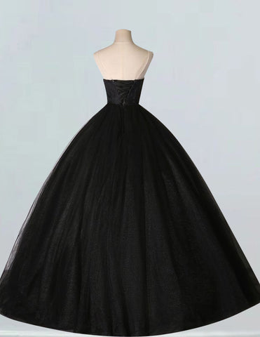 a black ball gown on a mannequin