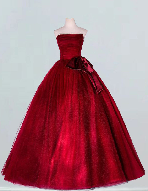 Burgundy strapless tulle ball gown for girls, perfect for prom and bridal events, featuring elegant and modest design with potential for off shoulder, cape, or corset variations1