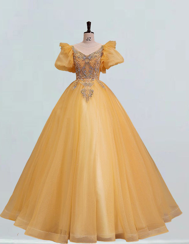 a yellow ball gown on a mannequin