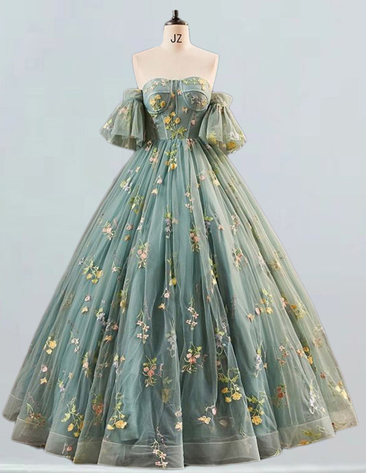 a dress on a mannequin with flowers on it