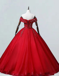 a red ball gown on a mannequin
