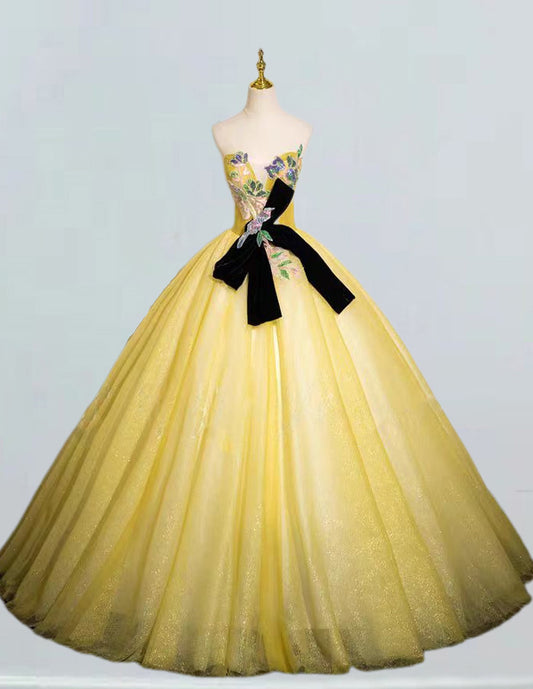 a dress on a mannequin with a black bow