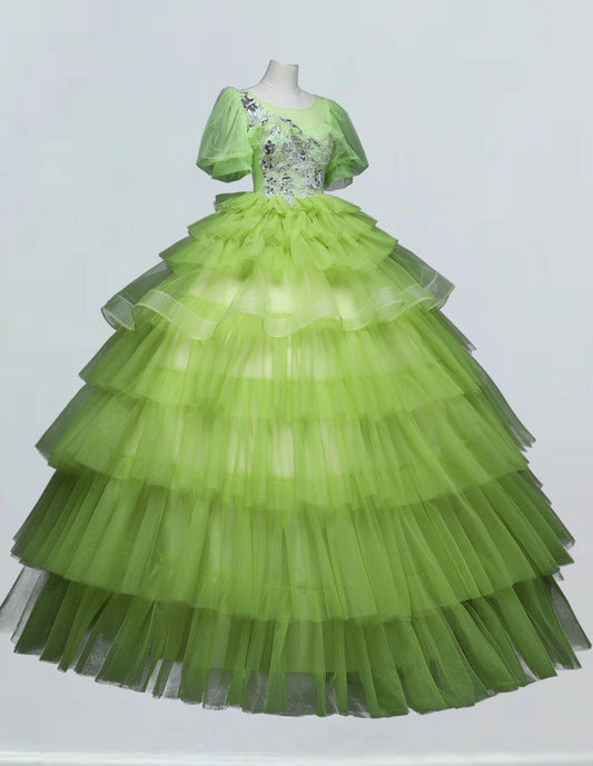 a green dress on display in a glass case
