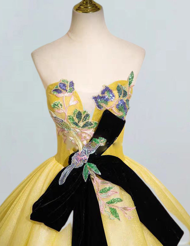 a yellow and black dress on a mannequin