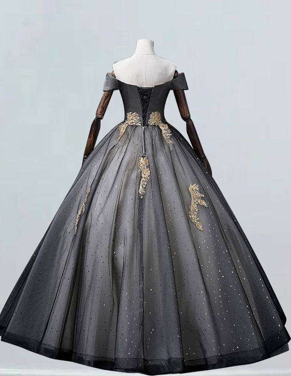 a black and gold ball gown on a mannequin