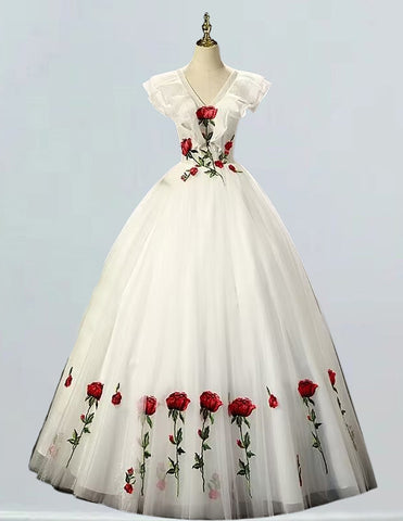 a white dress with red roses on it