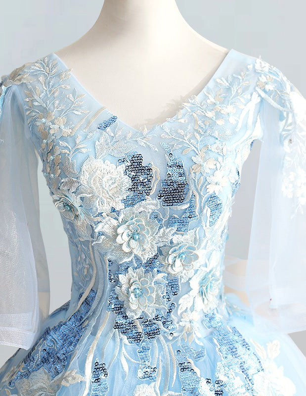 a blue dress with white flowers on it
