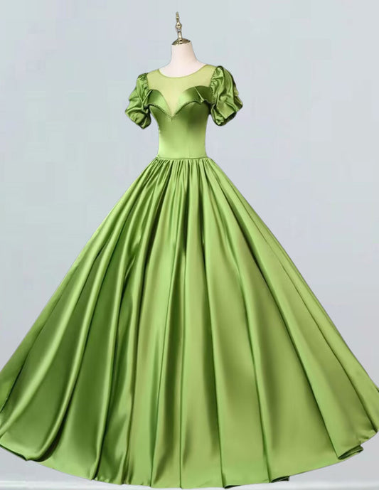 a green dress on a mannequin mannequin