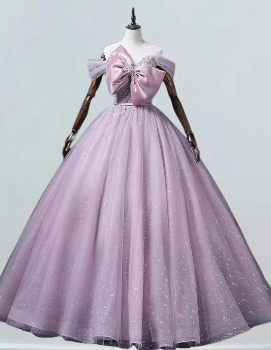 a dress on a mannequin with a pink bow