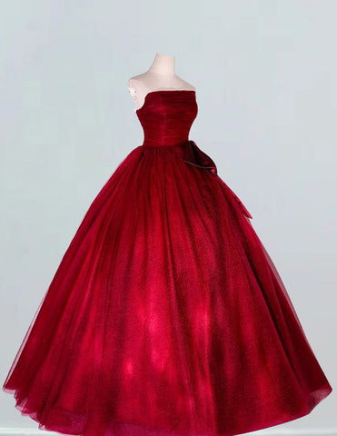 Burgundy strapless tulle ball gown for girls, perfect for prom and bridal events, featuring elegant and modest design with potential for off shoulder, cape, or corset variations0